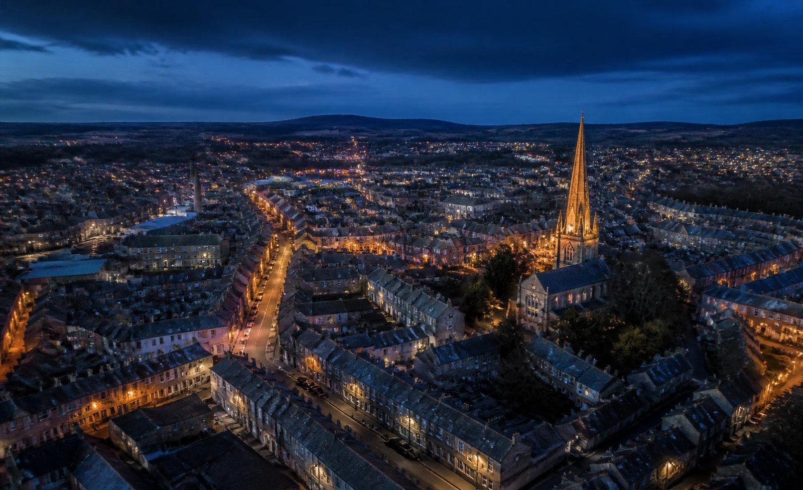 Aerial view of a UK town at dusk
